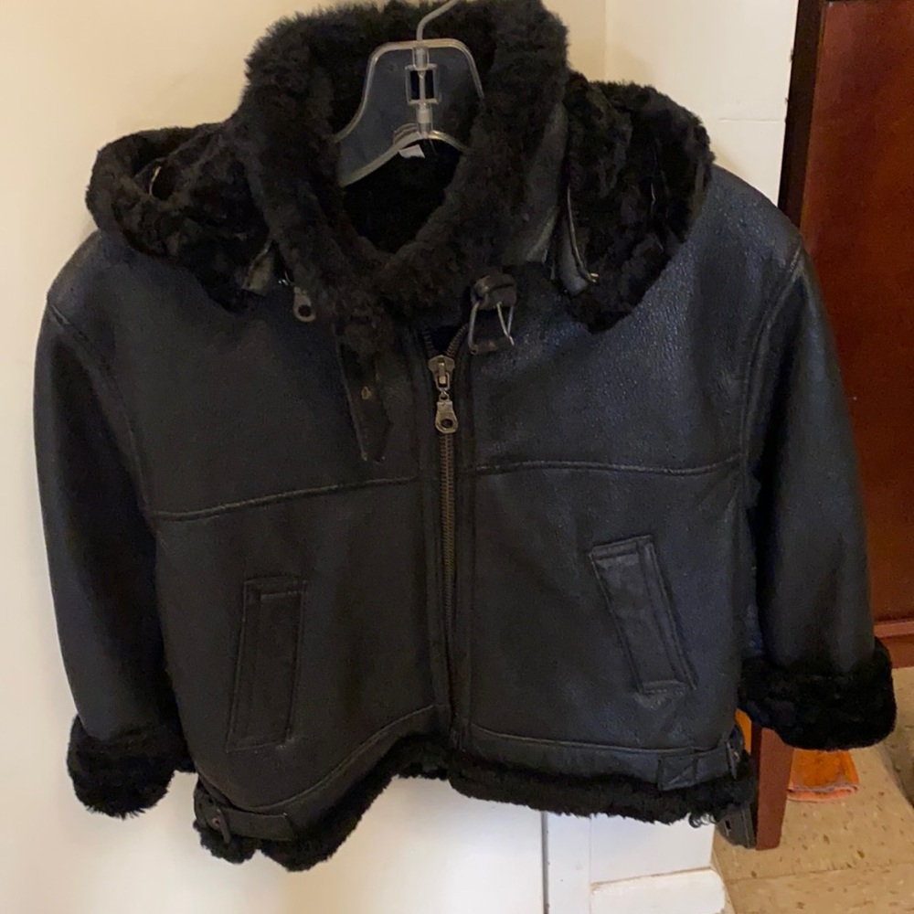 Boy’s heavy black hooded leather jacket.  Worn only a few times one winter.